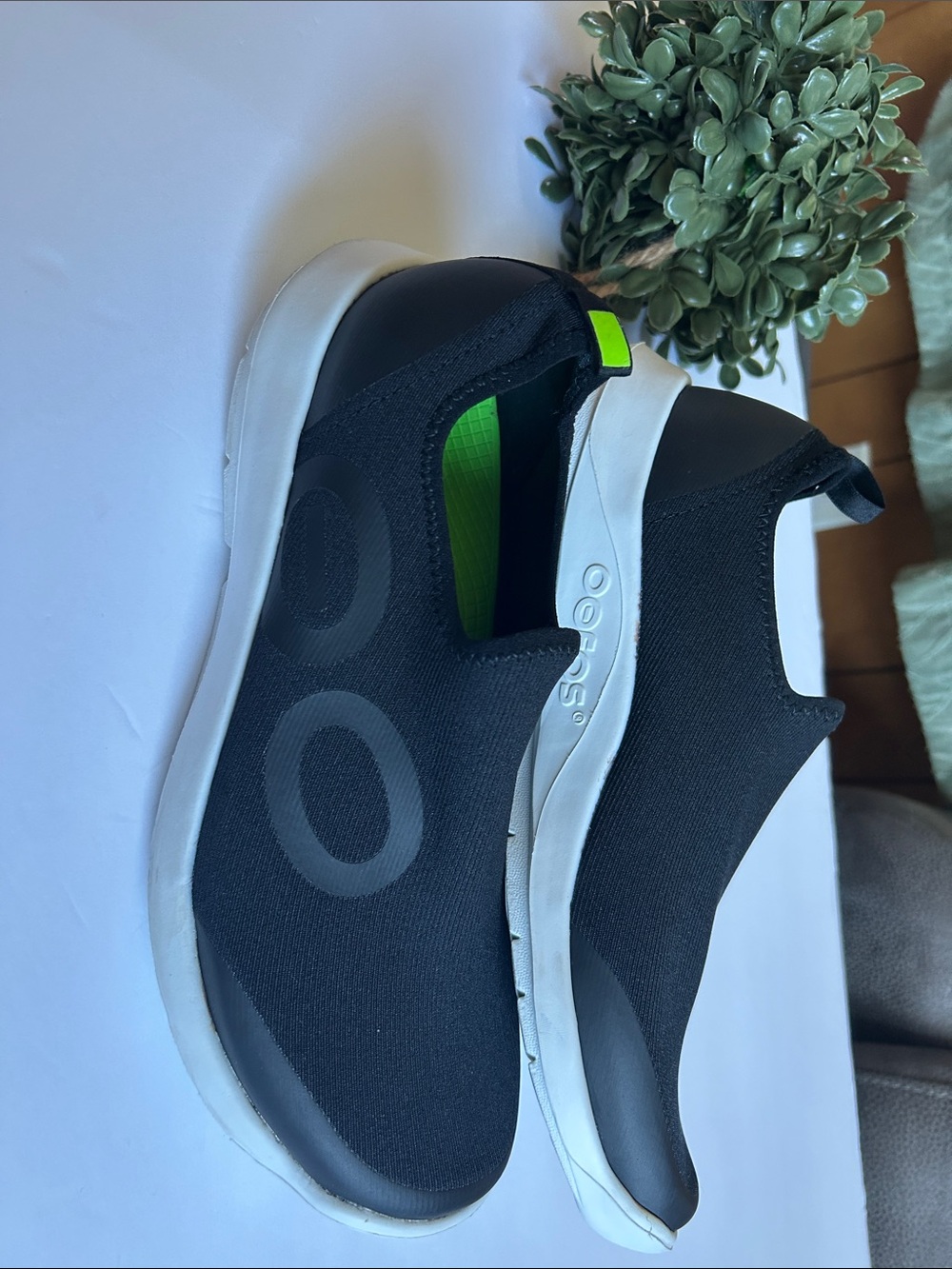 OOFOS Black Slip-On Recovery Loafers with White Sole and Neon Green Accent